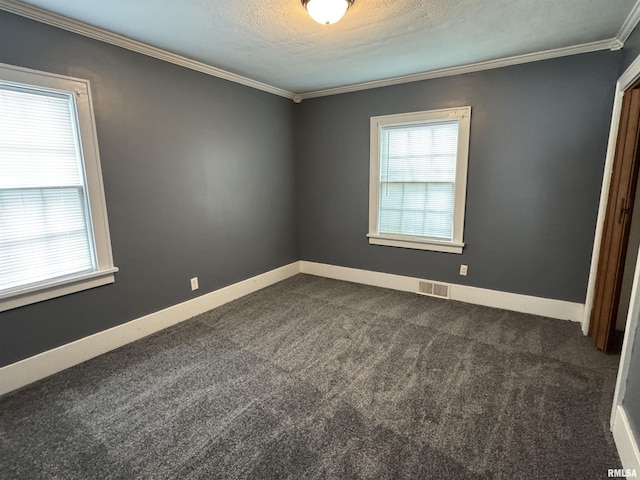 1210 W Macqueen Ave, Peoria, IL 61604 - spare room featuring dark carpet, ornamental molding, and a textured ceiling