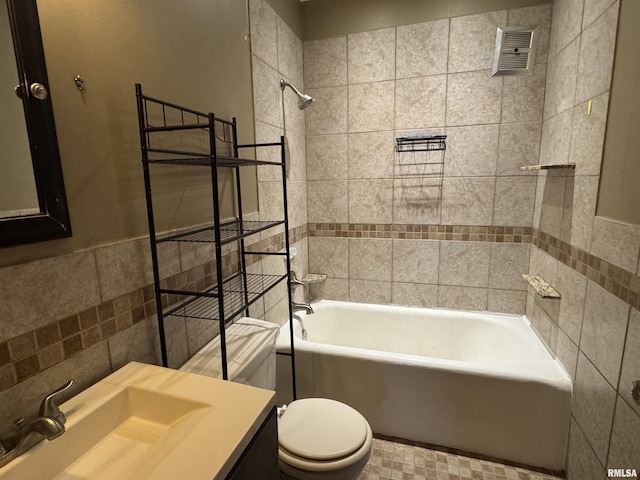 1210 W Macqueen Ave, Peoria, IL 61604 - full bathroom featuring tile walls, vanity, shower / bath combination, and a wainscoted wall