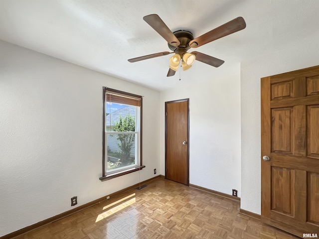 510 W Willcox Ave, Peoria, IL 61604 - unfurnished bedroom with baseboards and ceiling fan