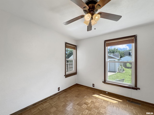 510 W Willcox Ave, Peoria, IL 61604 - spare room with baseboards and a ceiling fan