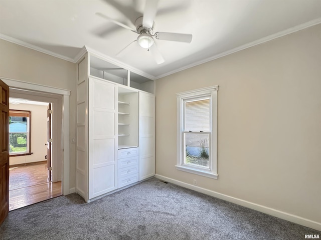 510 W Willcox Ave, Peoria, IL 61604 - unfurnished bedroom with carpet floors, crown molding, and a ceiling fan