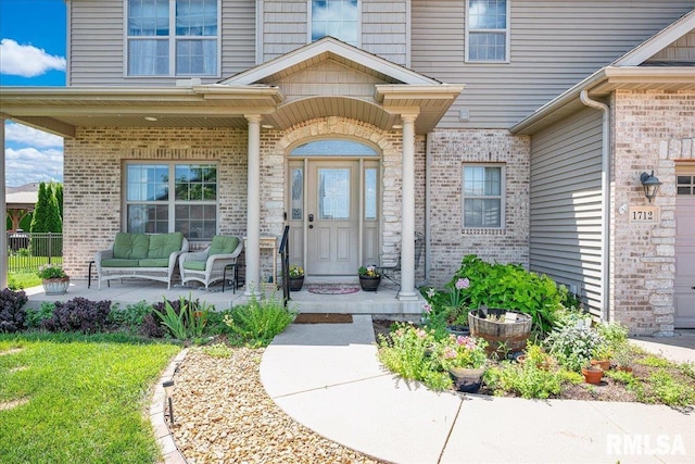 1712 Rustic Oak Dr, Washington, IL 61571 - entrance to property featuring brick siding and outdoor lounge area
