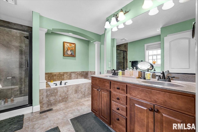 1712 Rustic Oak Dr, Washington, IL 61571 - full bathroom with a stall shower, a garden tub, double vanity, ornate columns, and tile patterned flooring