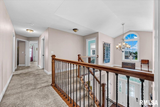 1712 Rustic Oak Dr, Washington, IL 61571 - corridor featuring a chandelier, an upstairs landing, light colored carpet, and vaulted ceiling