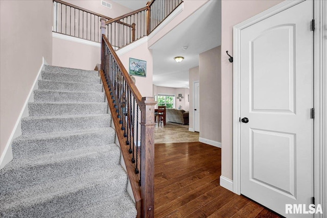 1712 Rustic Oak Dr, Washington, IL 61571 - staircase with hardwood / wood-style flooring and baseboards