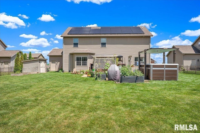 1712 Rustic Oak Dr, Washington, IL 61571 - back of house with a shed, roof mounted solar panels, and a fenced backyard