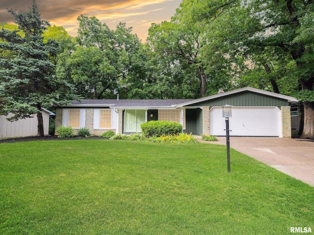 743 W Wonderview Dr, Dunlap, IL 61525 - ranch-style home featuring brick siding, a front lawn, an attached garage, and concrete driveway