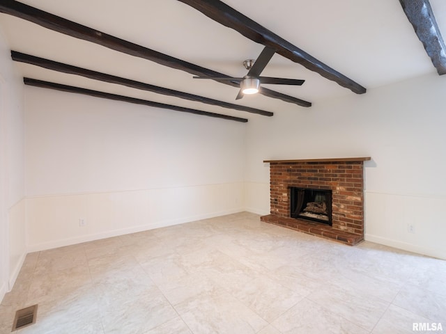 743 W Wonderview Dr, Dunlap, IL 61525 - unfurnished living room with beamed ceiling, a ceiling fan, wainscoting, and a brick fireplace