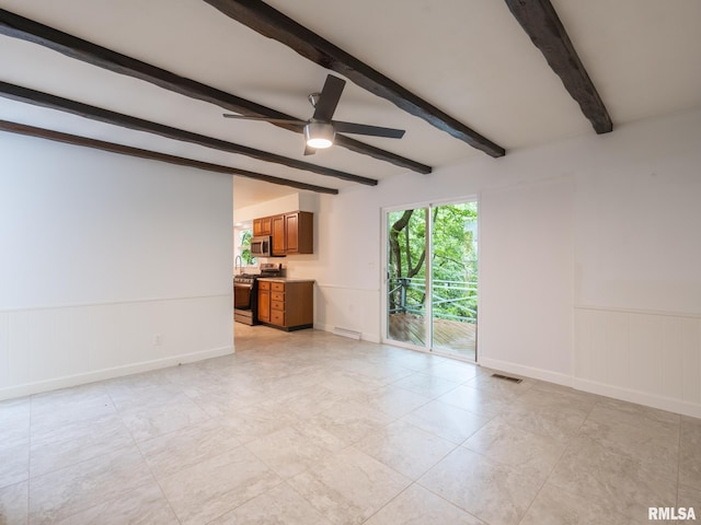743 W Wonderview Dr, Dunlap, IL 61525 - unfurnished living room with beam ceiling, ceiling fan, a wainscoted wall, and a brick fireplace