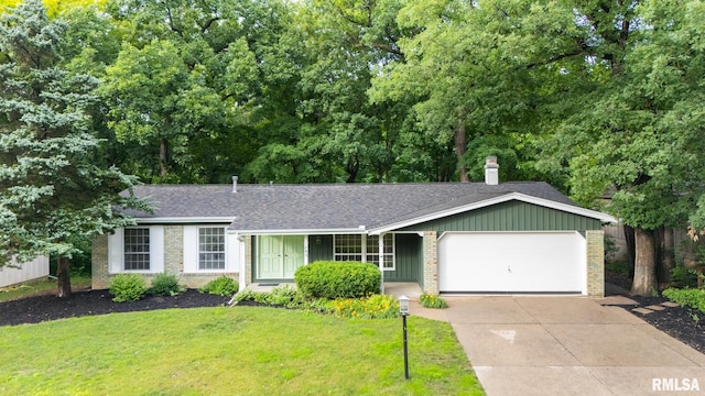 743 W Wonderview Dr, Dunlap, IL 61525 - view of front of house with brick siding, a garage, concrete driveway, and roof with shingles