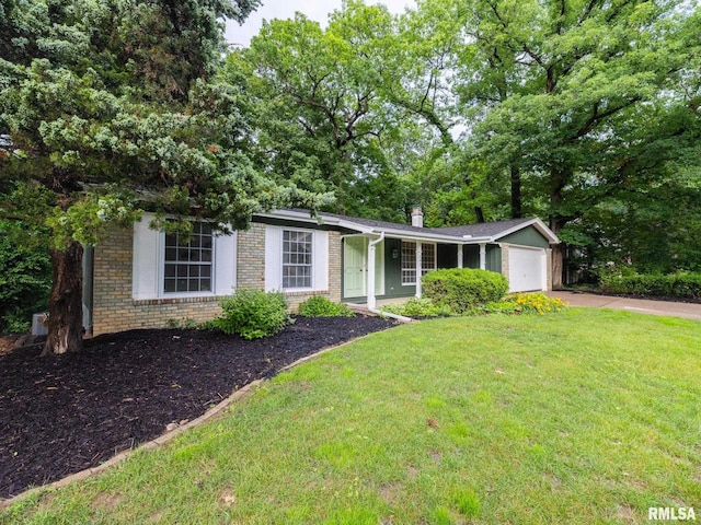 743 W Wonderview Dr, Dunlap, IL 61525 - view of front of home with driveway, a garage, a front lawn, and brick siding