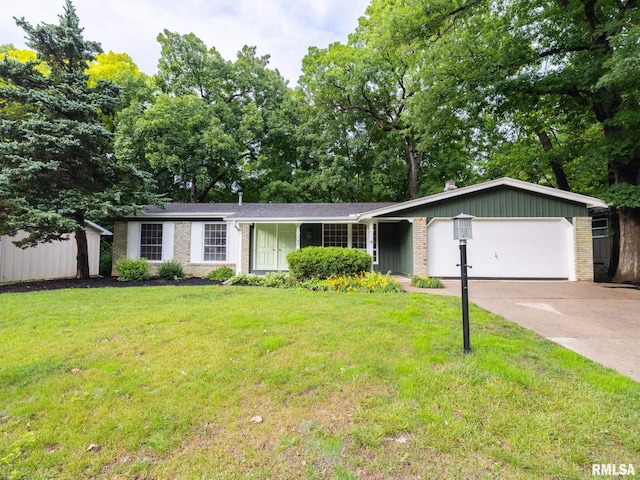 743 W Wonderview Dr, Dunlap, IL 61525 - single story home with a garage, brick siding, concrete driveway, and a front lawn