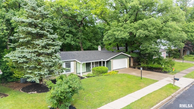 743 W Wonderview Dr, Dunlap, IL 61525 - view of front of property with driveway, a front lawn, a garage, and roof with shingles