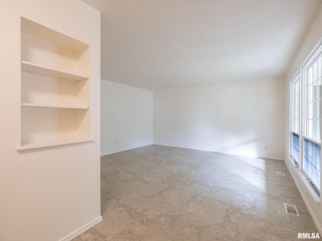 743 W Wonderview Dr, Dunlap, IL 61525 - spare room featuring built in features and baseboards