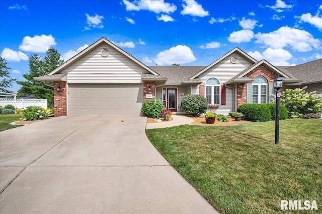 1619 Holland Ct, Chillicothe, IL 61523 - ranch-style home with brick siding, an attached garage, and concrete driveway