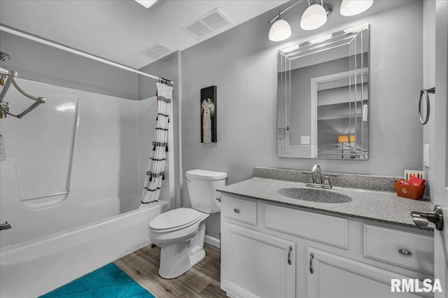 1619 Holland Ct, Chillicothe, IL 61523 - bathroom featuring vanity, shower / bathtub combination with curtain, and wood finished floors