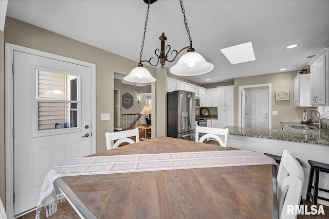 1619 Holland Ct, Chillicothe, IL 61523 - dining space featuring a skylight and recessed lighting