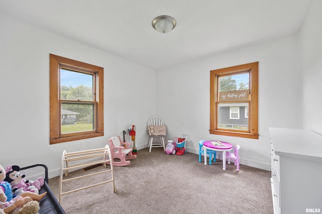 1900 S Airport Rd, Peoria, IL 61607 - recreation room with plenty of natural light and carpet