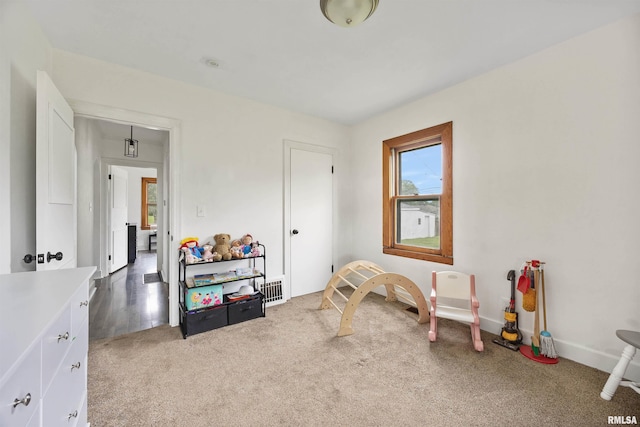 1900 S Airport Rd, Peoria, IL 61607 - recreation room featuring light carpet and baseboards