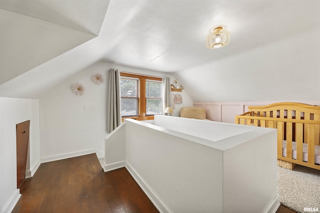 1900 S Airport Rd, Peoria, IL 61607 - bonus room with dark wood-type flooring and lofted ceiling