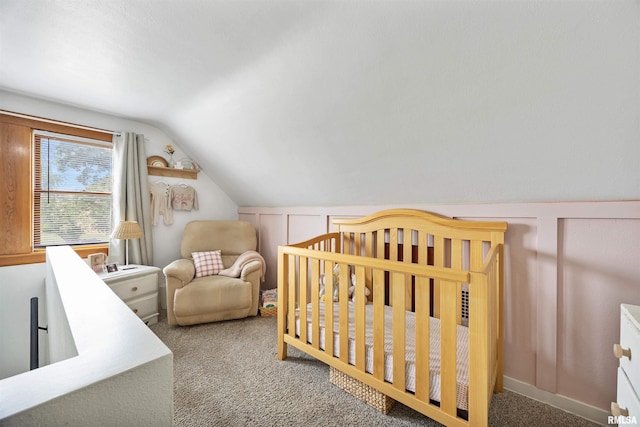1900 S Airport Rd, Peoria, IL 61607 - carpeted bedroom with vaulted ceiling and a nursery area