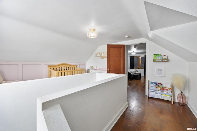 1900 S Airport Rd, Peoria, IL 61607 - hall featuring dark wood-style flooring and vaulted ceiling