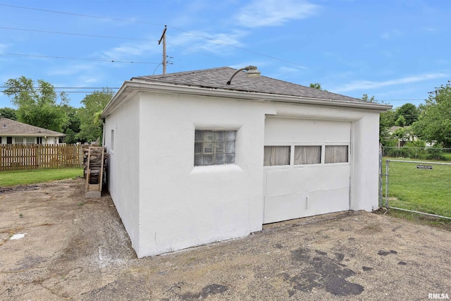 1900 S Airport Rd, Peoria, IL 61607 - view of property exterior with stucco siding and roof with shingles