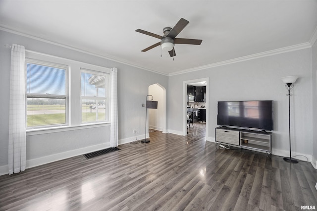 1900 S Airport Rd, Peoria, IL 61607 - unfurnished living room featuring ornamental molding, wood finished floors, ceiling fan, and arched walkways