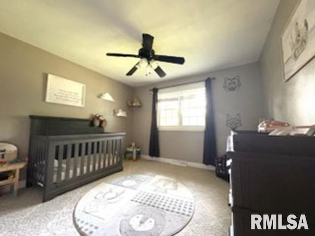 8109 N Blackbridge Rd, Edwards, IL 61528 - bedroom with carpet, a nursery area, and a ceiling fan