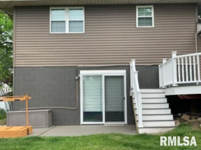 8109 N Blackbridge Rd, Edwards, IL 61528 - rear view of house featuring a wooden deck and stairs