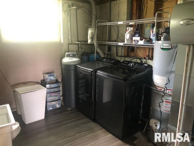 8109 N Blackbridge Rd, Edwards, IL 61528 - laundry room with washing machine and dryer, water heater, and wood finished floors