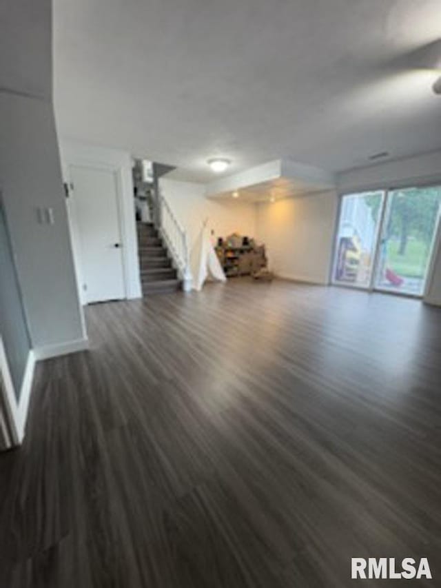 8109 N Blackbridge Rd, Edwards, IL 61528 - unfurnished living room with wood finished floors and stairway
