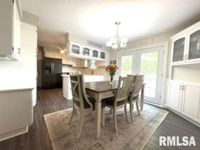 8109 N Blackbridge Rd, Edwards, IL 61528 - dining space with a chandelier and dark wood-type flooring