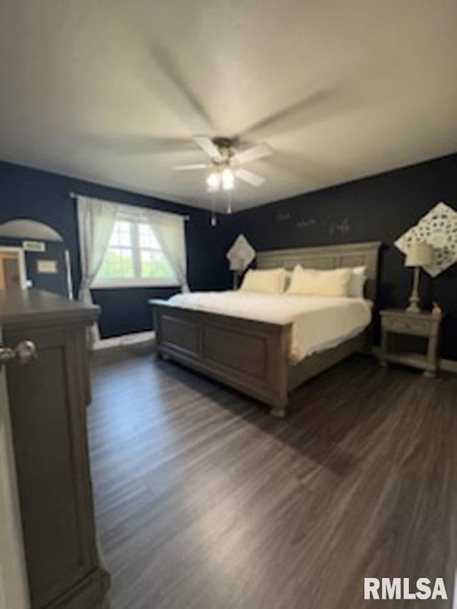 8109 N Blackbridge Rd, Edwards, IL 61528 - bedroom with dark wood-style flooring and a ceiling fan