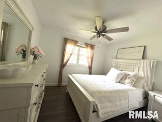 8109 N Blackbridge Rd, Edwards, IL 61528 - bedroom featuring dark wood-type flooring and ceiling fan