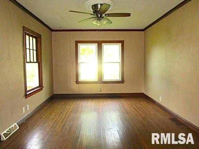 320 E Meadow Lawn St, Manito, IL 61546 - empty room featuring crown molding, a ceiling fan, and wood finished floors