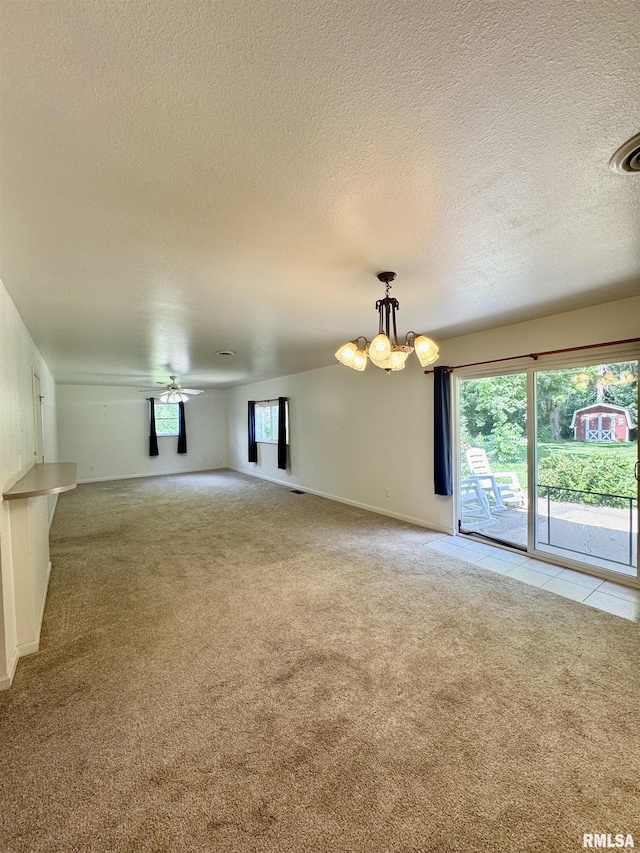3813 W Brighton Ave, Peoria, IL 61615 - unfurnished living room with light carpet, a chandelier, a textured ceiling, and a ceiling fan