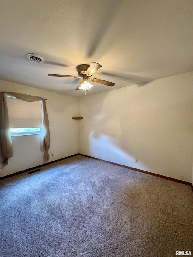 3813 W Brighton Ave, Peoria, IL 61615 - carpeted empty room featuring a ceiling fan and baseboards