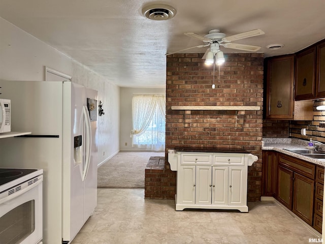 3813 W Brighton Ave, Peoria, IL 61615 - kitchen featuring white appliances, a ceiling fan, and light colored carpet