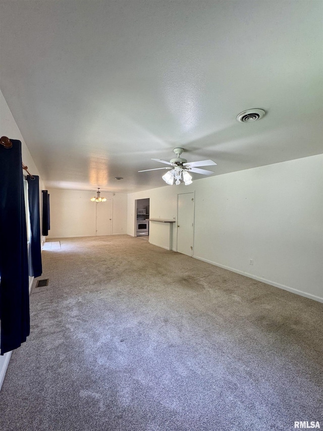 3813 W Brighton Ave, Peoria, IL 61615 - unfurnished living room with a ceiling fan, carpet floors, and a chandelier