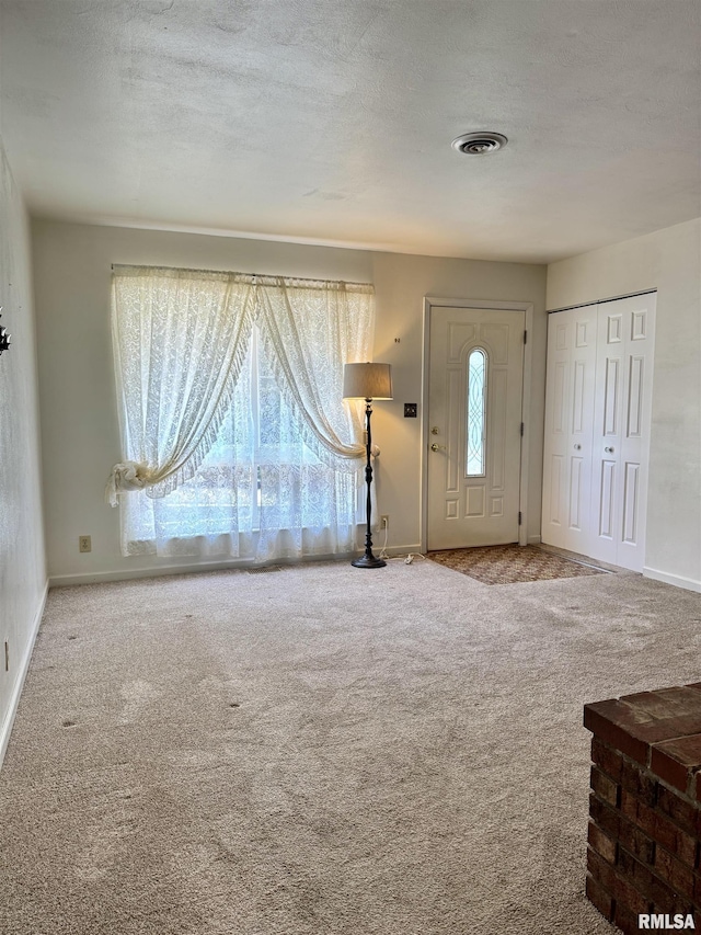 3813 W Brighton Ave, Peoria, IL 61615 - carpeted entryway with baseboards