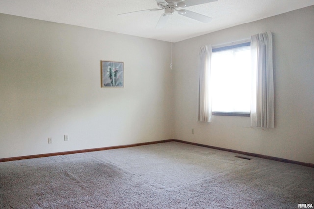 1003 Tonti Rd, Toulon, IL 61483 - carpeted empty room featuring ceiling fan and baseboards