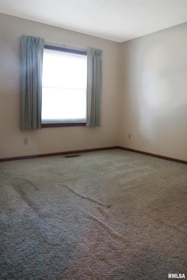 1003 Tonti Rd, Toulon, IL 61483 - empty room with carpet floors