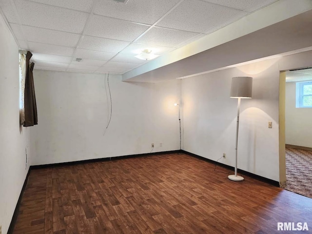 1003 Tonti Rd, Toulon, IL 61483 - basement featuring wood finished floors and a paneled ceiling