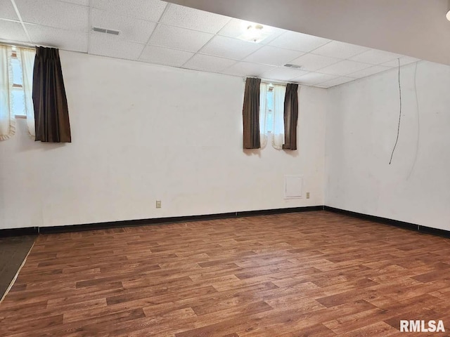 1003 Tonti Rd, Toulon, IL 61483 - below grade area with a paneled ceiling and wood finished floors