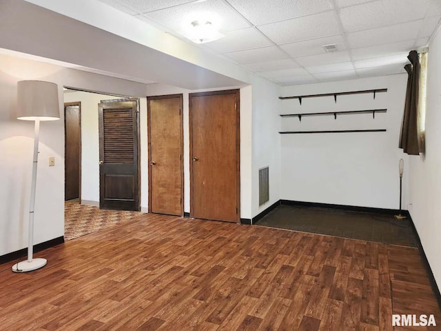 1003 Tonti Rd, Toulon, IL 61483 - unfurnished room with a paneled ceiling and wood finished floors