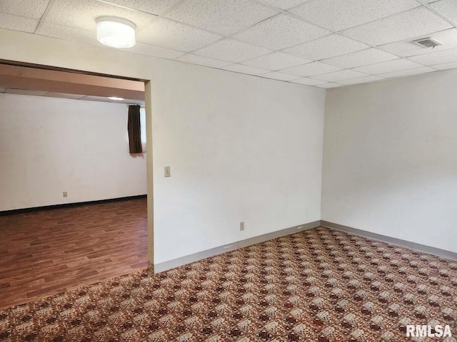1003 Tonti Rd, Toulon, IL 61483 - empty room with a paneled ceiling and wood finished floors