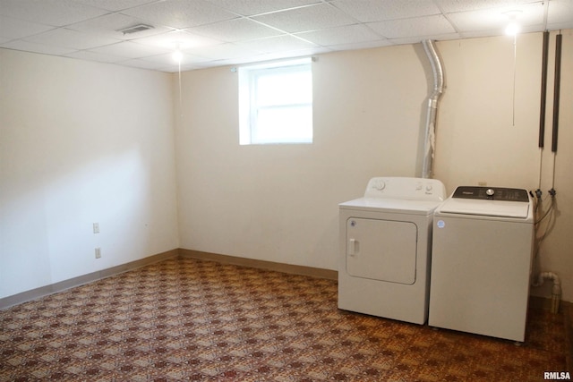 1003 Tonti Rd, Toulon, IL 61483 - washroom with washer and dryer and dark flooring