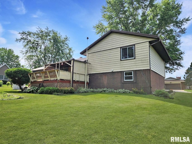 1003 Tonti Rd, Toulon, IL 61483 - back of property featuring brick siding, a yard, and a deck