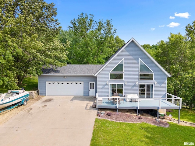 161 Lakecrest Pl, Dahinda, IL 61488 - view of front of home with a garage, concrete driveway, a front lawn, and a wooden deck